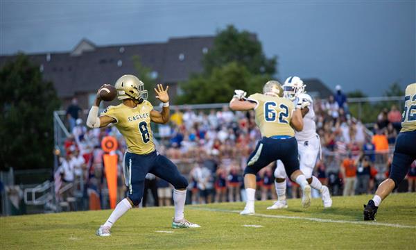 Independence High football player prepares to throw ball